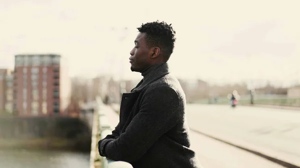 Pensive Black African Man Standing Bridge Thinking Life Looking Horizon — Φωτογραφία Αρχείου