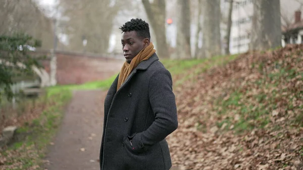 Pensive Black Man Standing Cold Winter Season Wearing Scar Coat — 图库照片