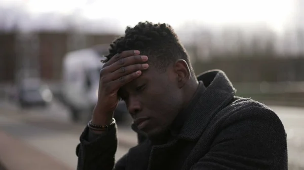Preoccupied Black African Man Sitting City Street Curb Feeling Anxiety — Stock Fotó