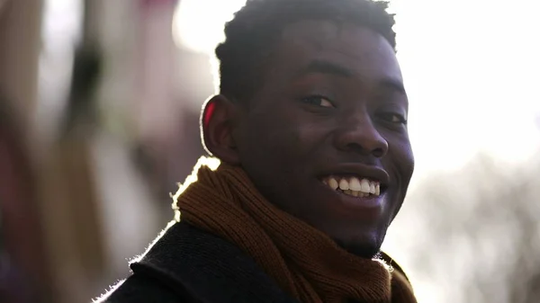 Portrait Black African Man Smiling Camera Flare Sunlight Outdoors — Stock fotografie