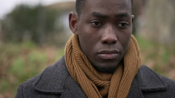 stock image Pensive thoughtful African black man standing outside at park thinking about life