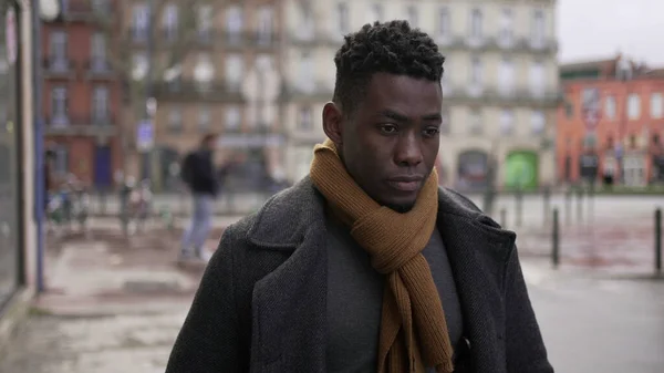 Pensive Young Black Man Walking City Cold — ストック写真