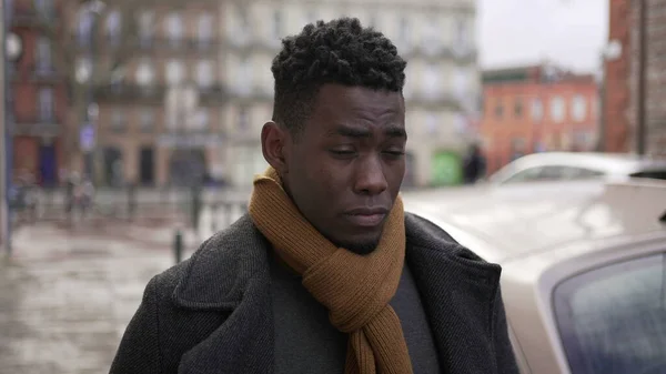 Thoughtful African Man Walking Sidewalk Cold Winter Season — стокове фото