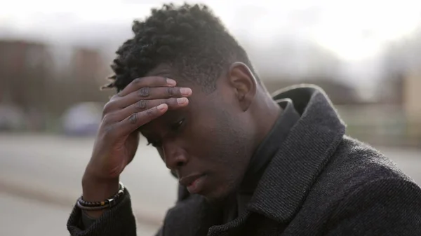 Worried Black Man Sitting Floor Street Having Problems Rubbing Face — Φωτογραφία Αρχείου