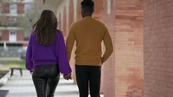 stock image Back of couple walking outdoors holding hands