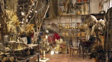Interior of Flower Shop with decoration. Small business store studio. Decorations arrangements and gifts. Service and sale of home plants