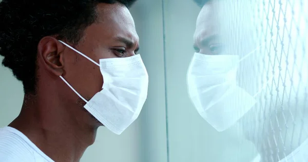 Young black person wearing coronavirus face mask