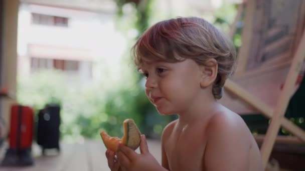 Cute Little Boy Eating Yellow Melon Fruit Child Taking Bite — Stock Video