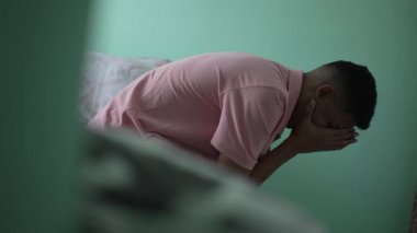 Depressed man in crisis. Sad unhappy person covering face suffering from mental illness