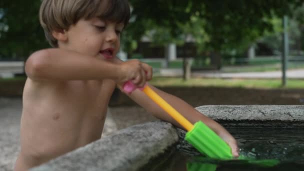 Joyful Child Playing Water Gun Gun Blaster Swimming Pool Outdoor — Stock Video