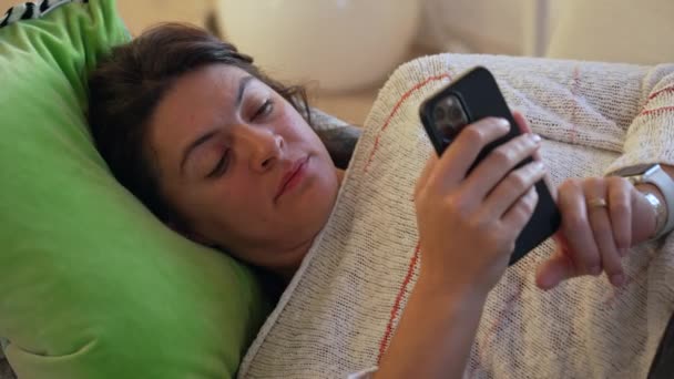 Woman Looking Cellphone Device Laying Couch Home Leisure Lifestyle Person — Stock Video
