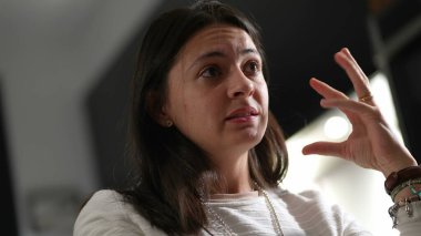 Casual woman in conversation talking among friends explaining concerns