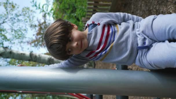 One Adorable Little Boy Sitting Playground Park Structure Smiling Camera — Vídeos de Stock