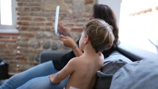 Mother Multi Tasking Baby Toddler Home Using Computer Laptop Candid — Vídeo de Stock