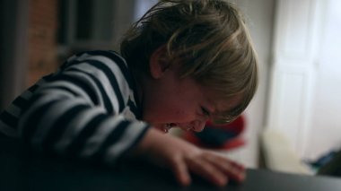 Upset crying baby boy. Angry toddler infant cries