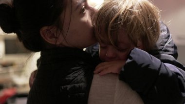 Upset child boy. mother consoling toddler baby