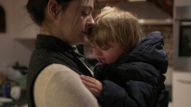 Upset child boy. mother consoling toddler baby