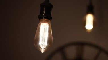 Turning ceiling light bulbs ON and OFF. Illumination energy concept