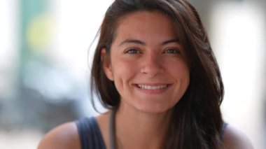 Portrait of a happy woman with dimples smiling at camera closeup face. 30s female person outside