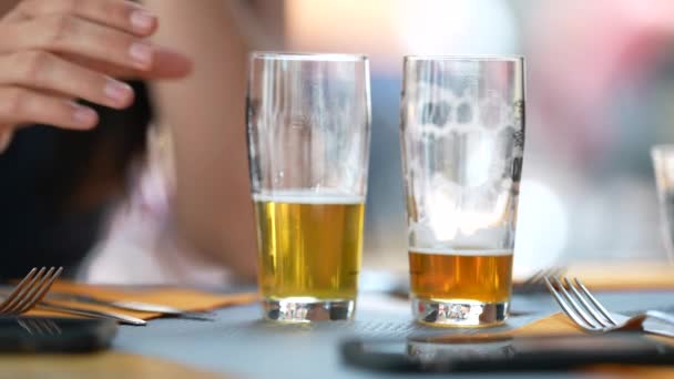 Female Hand Picking Glass Draft Beer Restaurant Two Half Full — Stockvideo