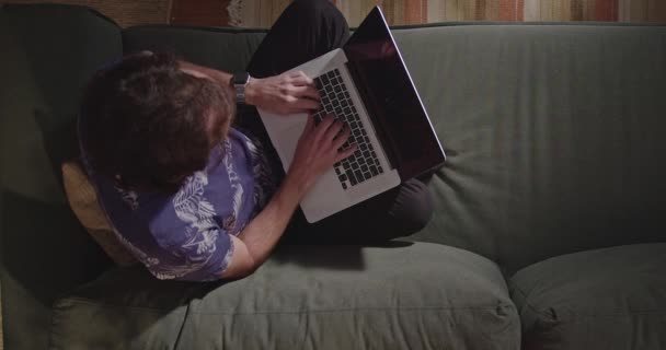 Young Man Using Laptop Computer Laying Couch Night Top View — Stock Video
