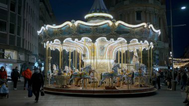 Toulouse, France, January 6 2020 - City downtown carousel and crowd walking