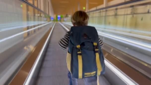 Back Little Boy Standing Moving Corridor Airport Child Wearing Backpag — Wideo stockowe