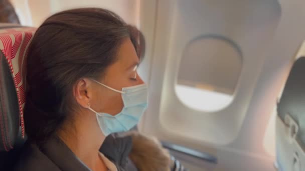 Woman Wearing Face Mask Traveling Plane Passenger Protection Pandemic — Stockvideo