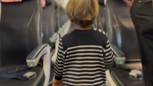 One Little Boy Passenger Searching Plane Aisle Seat Back Child — Wideo stockowe