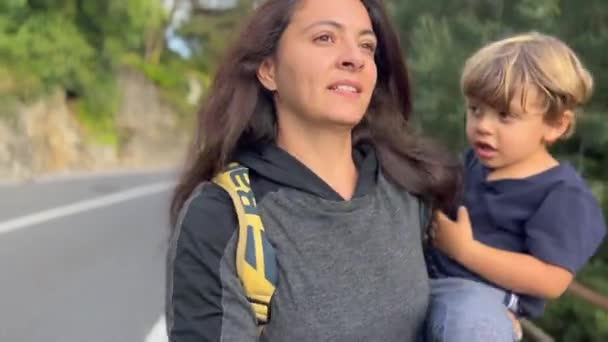 Mother Carrying Child Arms Walking Countryside Road Happy Little Boy — Stockvideo