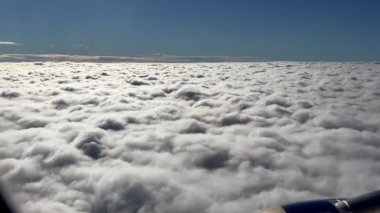 Clouds high above the sky flying by plane