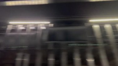 Railway undergrounds lights passing by in public transportation at night