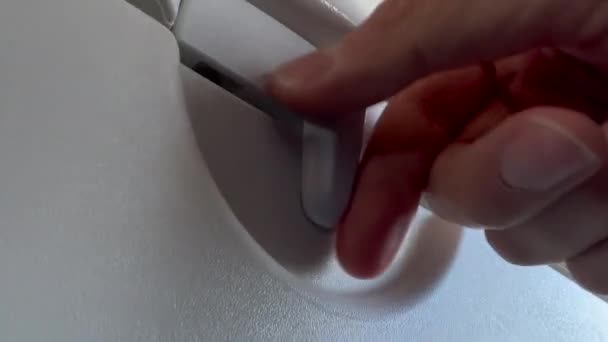 Closeup Hand Opening Closing Plane Tray Table — Wideo stockowe