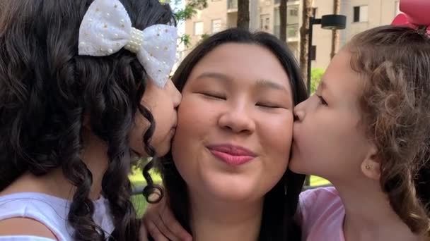 Happy Daughters Kissing Mother Cheek Ethnically Diverse People Close Faces — Stockvideo