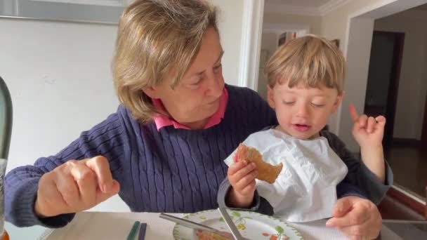 Joyful Grandmother Holding Baby Grandson Arms Breakfast — Wideo stockowe