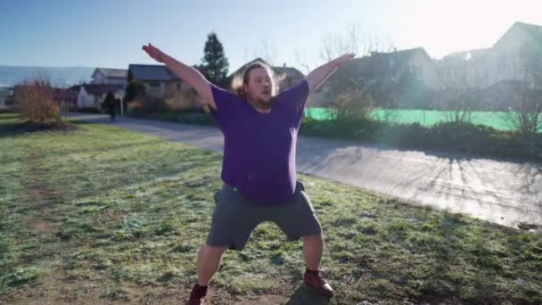 One Overweight Young Man Doing Jumping Jacks Outdoors Cold Back — Vídeo de Stock