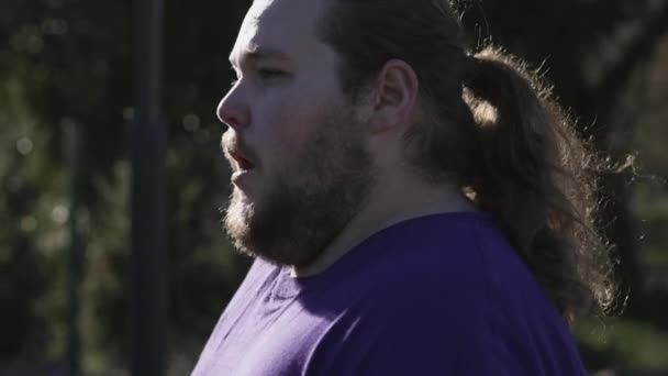 One Fat Man Profile Exercising Outdoors Overweight Jogger Stopping Middle — Stockvideo