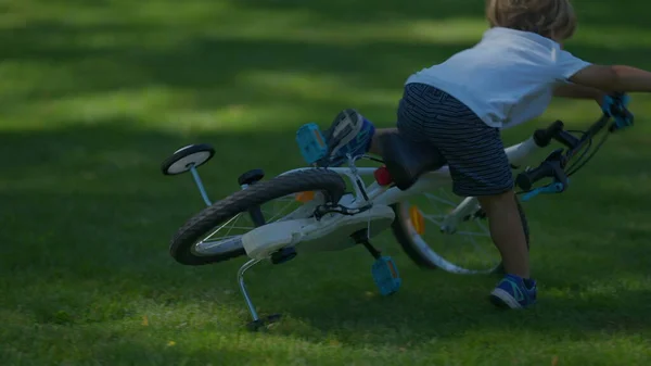 Child crashes bicycle falling to the ground kid real life accident