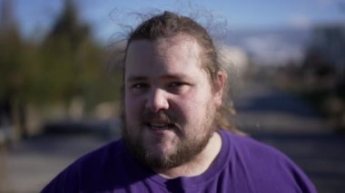 One angry young man arguing and pointing to camera POV. Portrait of a person speaking with upset emotion. Judgemental blaming expression