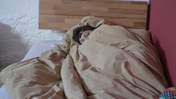 One Lazy Young Boy Laying Bed Duvet Sheets Feeling Comfortable — Stockvideo