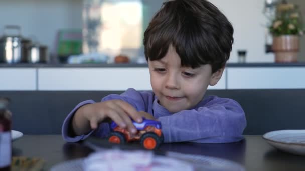 Child Playing Car Toy Seated Breakfast Table One Small Boy — Video