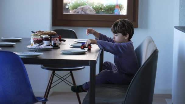 One Cute Little Boy Playing Car Toy Breakfast Table Child — Videoclip de stoc