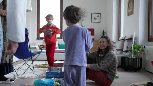 Family Celebrating Christmas Present Table Morning Happy Children Receiving Gift — Wideo stockowe