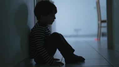 Boy covers face with his hands. Stressed child. Domestic Family violence and aggression concept. concept for bullying and frustration