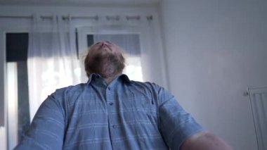 Overjoyed entrepreneur celebrating success in front of computer. Ecstatic joyful young man receives GREAT notification