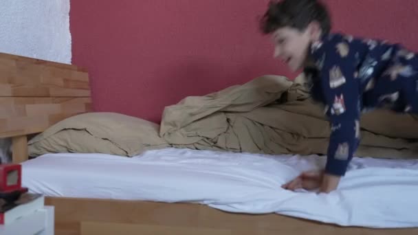 One Lazy Happy Young Boy Jumping Bed Morning Wearing Pajama — Stockvideo