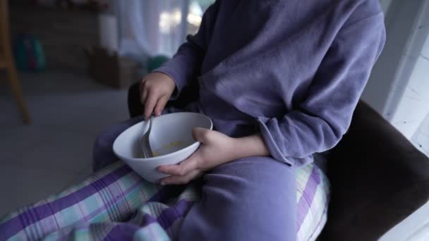 Small Boy Eating Cereals Morning Child Wearing Pajama Holding Bowl — Wideo stockowe