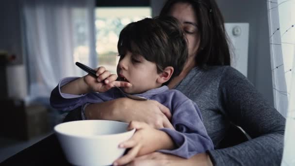Small Boy Sitting Mother Lap Morning Child Wearing Pajamas Holding — Stock video
