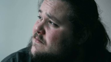 Desperate man crying in despair covering face in shame and regret. Person suffering from emotional pain. Depression concept