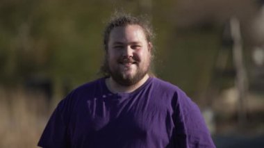 Portrait of a happy casual man smiling at camera